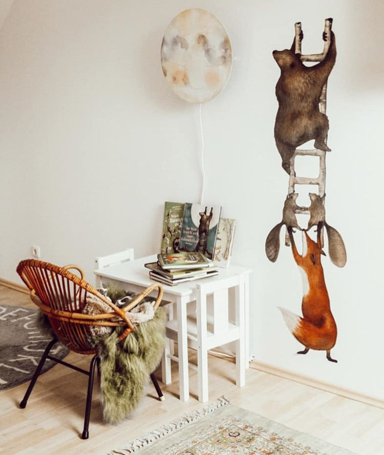 Animals on the Ladder wall decal in a white nursery with the Moonkiss wall lamp and a Hartendief picture book