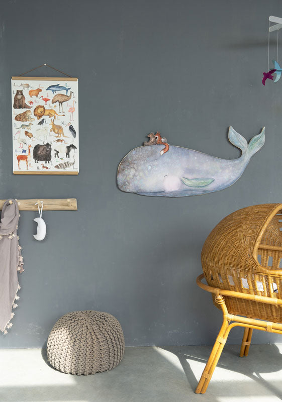 On the Back of the Whale wall decal by Hartendief on a gray nursery wall beside a crib