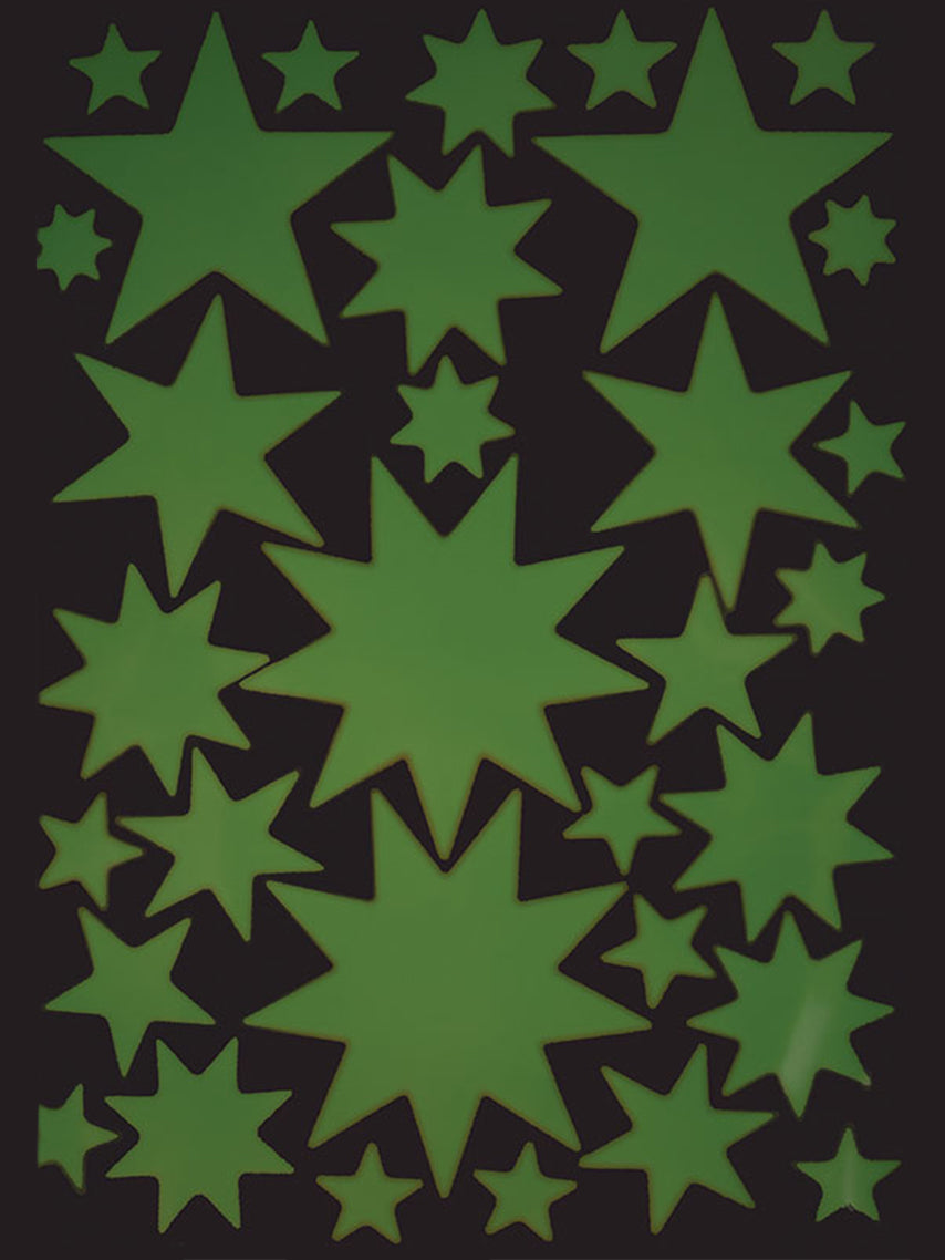 Glow in the Dark Starry Sky Stickers by Hartendief glowing green on a nursery wall
