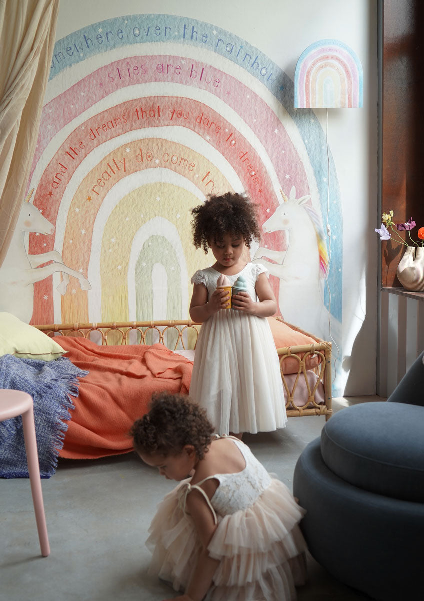 Rainbow wall lamp by Hartendief in the nursery with children playing – cheerful lighting in the play corner