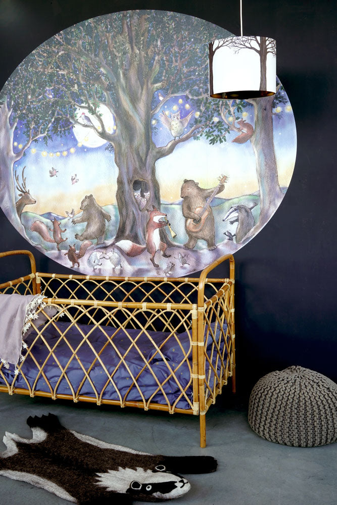 Party Animals S wallpaper by Hartendief on a dark wall with a bamboo cot and the Forest pendant lamp